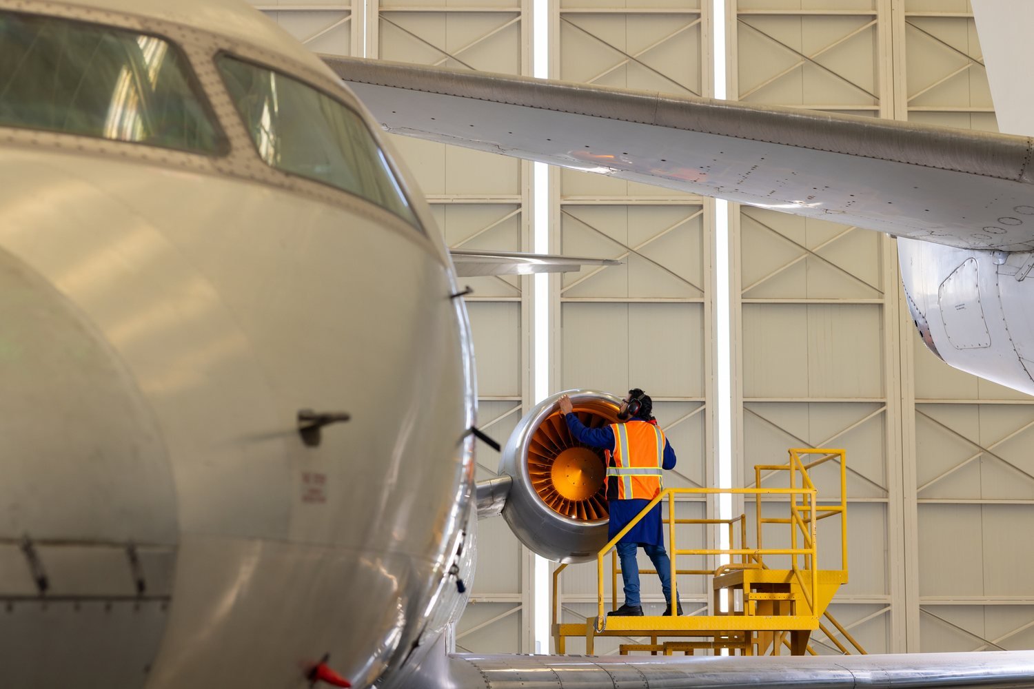Aviation engineer checking an aircraft engine